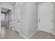 Hallway with tile floors leading to a bedroom and the front door at 8349 Pollenzo Ave, Las Vegas, NV 89178