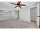 Upstairs carpeted hallway with white railings, and ceiling fan at 8349 Pollenzo Ave, Las Vegas, NV 89178