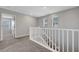 Hallway with plush carpeting, neutral walls, and white railings at 8349 Pollenzo Ave, Las Vegas, NV 89178