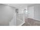 Hallway with carpet flooring featuring white railing and doors at 8349 Pollenzo Ave, Las Vegas, NV 89178
