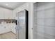 Updated kitchen with stainless steel refrigerator and walk-in pantry with wire shelving at 8349 Pollenzo Ave, Las Vegas, NV 89178