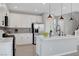 Modern kitchen featuring white cabinets, stainless steel appliances, and a kitchen island at 8349 Pollenzo Ave, Las Vegas, NV 89178