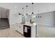 Open-concept kitchen featuring a large island, modern appliances, and seamless integration with the living space at 8349 Pollenzo Ave, Las Vegas, NV 89178