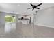 Open floor plan showcasing the kitchen, living area, and backyard access at 8349 Pollenzo Ave, Las Vegas, NV 89178