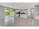 Open floor plan with tile flooring and large sliding glass door to backyard at 8349 Pollenzo Ave, Las Vegas, NV 89178
