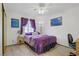 Bright bedroom featuring neutral decor, fan, and large double door closet at 8410 Eldora Ave # 2082, Las Vegas, NV 89117