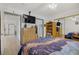 Bedroom featuring a dresser, TV, mirrored closet and view to an ensuite bathroom at 8410 Eldora Ave # 2082, Las Vegas, NV 89117