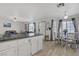 Open plan living, dining, and kitchen area with bright natural light and neutral decor at 8410 Eldora Ave # 2082, Las Vegas, NV 89117
