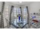 Stylish dining area with a modern glass table, seating for four, and lots of natural light at 8410 Eldora Ave # 2082, Las Vegas, NV 89117