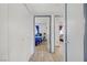 Hallway leading to bedrooms with bright neutral paint and grey trim at 8410 Eldora Ave # 2082, Las Vegas, NV 89117