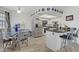 Modern eat-in kitchen with granite countertops, stainless steel appliances, and a view to the dining area at 8410 Eldora Ave # 2082, Las Vegas, NV 89117