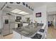 Close-up of a modern kitchen featuring granite countertops and stainless steel appliances at 8410 Eldora Ave # 2082, Las Vegas, NV 89117
