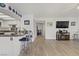 Spacious living room featuring an open floor plan with an eat-in kitchen and an entertainment area at 8410 Eldora Ave # 2082, Las Vegas, NV 89117