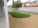 Landscaped backyard with green grass at 8640 Portofino Ct, Las Vegas, NV 89117