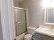 Bathroom features a white shower-tub, a toilet, and a vanity with modern fixtures at 8640 Portofino Ct, Las Vegas, NV 89117