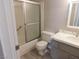Bathroom featuring a shower-tub, a toilet, and a vanity with modern fixtures at 8640 Portofino Ct, Las Vegas, NV 89117