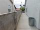 Exterior walkway with a trash can at 8640 Portofino Ct, Las Vegas, NV 89117