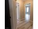 Hallway featuring modern flooring, neutral walls, and white trim at 8640 Portofino Ct, Las Vegas, NV 89117