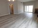 Spacious living area featuring new laminate floors, fireplace and access to the backyard at 8640 Portofino Ct, Las Vegas, NV 89117
