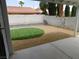 Back patio overlooking the backyard featuring a modern landscaped space at 8640 Portofino Ct, Las Vegas, NV 89117
