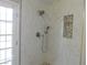 Shower features white marble-style tile and mosaic accents at 8640 Portofino Ct, Las Vegas, NV 89117