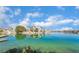 Beautiful waterfront view with palm trees reflecting in the water on a sunny day with bright blue sky at 8640 Portofino Ct, Las Vegas, NV 89117