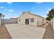 Backyard featuring concrete patio, desert landscaping, and slider door at 884 Adobe Flat Dr, Henderson, NV 89011