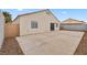Backyard featuring concrete patio and desert landscaping and a sliding glass door at 884 Adobe Flat Dr, Henderson, NV 89011