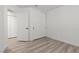 Bedroom featuring a closet with white doors and wood-look floors at 884 Adobe Flat Dr, Henderson, NV 89011