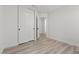 Bright bedroom with white walls, wood-look floors and closet at 884 Adobe Flat Dr, Henderson, NV 89011