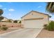 Single-story home showing a two-car garage, desert landscaping, and a neutral color scheme at 884 Adobe Flat Dr, Henderson, NV 89011