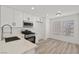 Bright kitchen with stainless steel appliances and stone countertops at 884 Adobe Flat Dr, Henderson, NV 89011