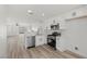 Contemporary kitchen with stainless steel appliances, white cabinetry, and an open layout at 884 Adobe Flat Dr, Henderson, NV 89011