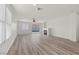 Bright and airy living room with new flooring, large windows, and a cozy fireplace at 884 Adobe Flat Dr, Henderson, NV 89011