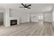Spacious living room featuring new hardwood floors, fireplace, and an abundance of natural light at 884 Adobe Flat Dr, Henderson, NV 89011