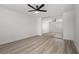 Main bedroom featuring ceiling fan, mirrored closet and light-colored floors at 884 Adobe Flat Dr, Henderson, NV 89011