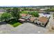 Aerial view of home with covered patio and spacious parking area, landscaped grass, and desert landscaping at 8970 W Lone Mountain Rd, Las Vegas, NV 89129
