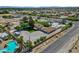 Aerial view of a residential property featuring a pool, large parking area and a well-maintained home at 8970 W Lone Mountain Rd, Las Vegas, NV 89129