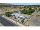Expansive lot featuring a trailer, vehicle parking, and mature landscaping, offering versatile space and scenic views at 8970 W Lone Mountain Rd, Las Vegas, NV 89129