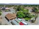 Wide-angle shot showcases lot with detached garages, desert landscaping, and spare parking area at 8970 W Lone Mountain Rd, Las Vegas, NV 89129
