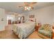 Bright bedroom featuring a sitting area and a ceiling fan that enhances comfort at 8970 W Lone Mountain Rd, Las Vegas, NV 89129