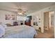This bedroom has a ceiling fan, carpet and a door that provides access to other areas of the house at 8970 W Lone Mountain Rd, Las Vegas, NV 89129