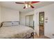 Cozy bedroom with a comfortable bed, closet, and open doorway to another room, creating a connected suite at 8970 W Lone Mountain Rd, Las Vegas, NV 89129