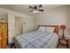 Cozy bedroom with ceiling fan, carpeted floor and neutral walls offers a relaxing retreat at 8970 W Lone Mountain Rd, Las Vegas, NV 89129
