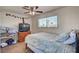 Comfortable bedroom with natural light, a dresser, and relaxed decor perfect for a serene retreat at 8970 W Lone Mountain Rd, Las Vegas, NV 89129