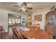 Dining room featuring a wooden dining table with a view of the backyard at 8970 W Lone Mountain Rd, Las Vegas, NV 89129
