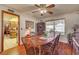 Dining room with wood flooring, an antique hutch, and a traditional wooden dining table at 8970 W Lone Mountain Rd, Las Vegas, NV 89129