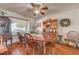 Dining room with hardwood floors and an antique hutch adjacent to a dining table set for six at 8970 W Lone Mountain Rd, Las Vegas, NV 89129