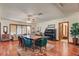 Elegant dining area with a large table, classic piano, and natural light, perfect for Gathering gatherings at 8970 W Lone Mountain Rd, Las Vegas, NV 89129