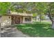 Beautiful home with a stone-accented facade, covered porch, and expansive lawn, creating a welcoming curb appeal at 8970 W Lone Mountain Rd, Las Vegas, NV 89129